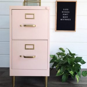 blush pink painted filing cabinet with gold legs and hardware