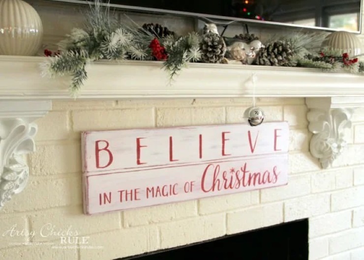 White wooden christmas sign with red writing 