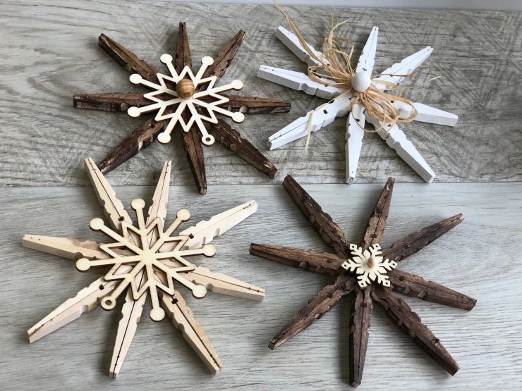 wooden snowflake ornaments made from clothes pins 