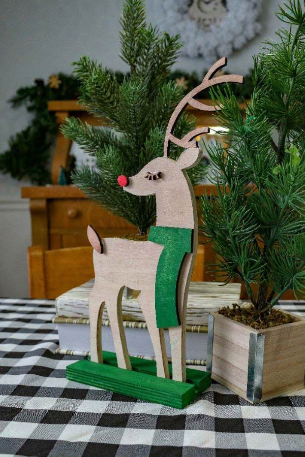 wooden reindeer cut out with green accents