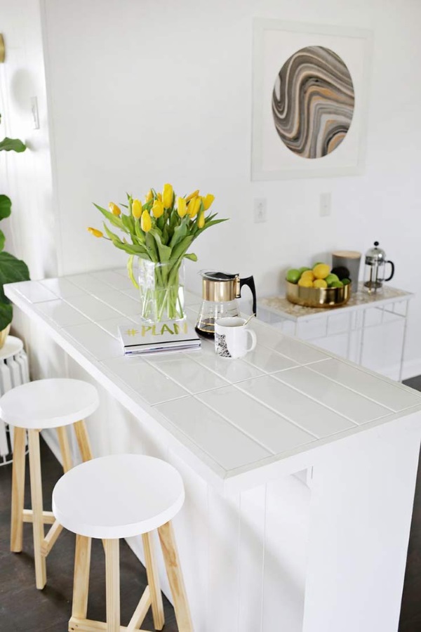 White DIY Square Tile Counter Tops with Daffodils on on the center island