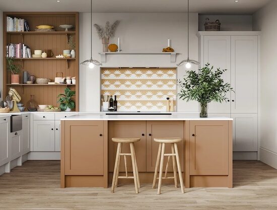 white kitchen with terracotta accent wall and kitchen island